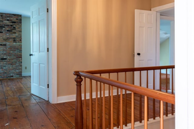 corridor featuring dark wood-type flooring