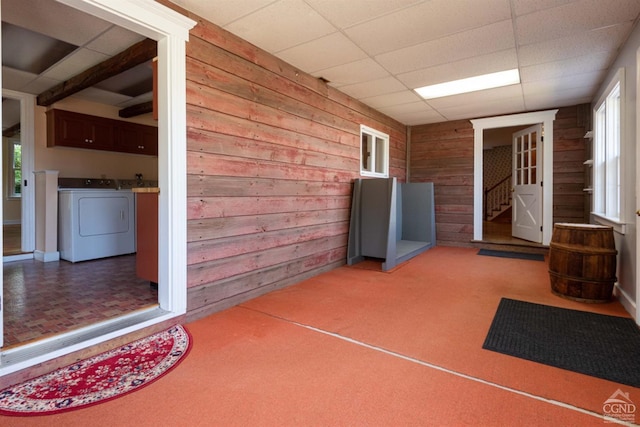 view of patio featuring washer and dryer and a porch