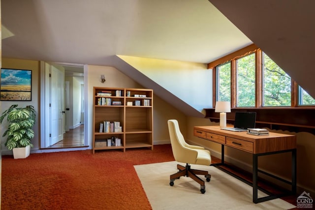 home office featuring carpet flooring and lofted ceiling