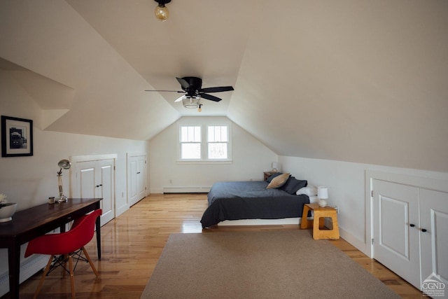bedroom featuring ceiling fan, light wood-type flooring, baseboards, a baseboard radiator, and lofted ceiling