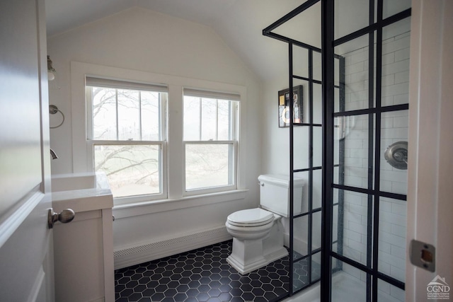 bathroom with toilet, baseboards, a baseboard heating unit, a tile shower, and vaulted ceiling