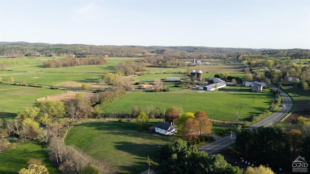 birds eye view of property with a rural view