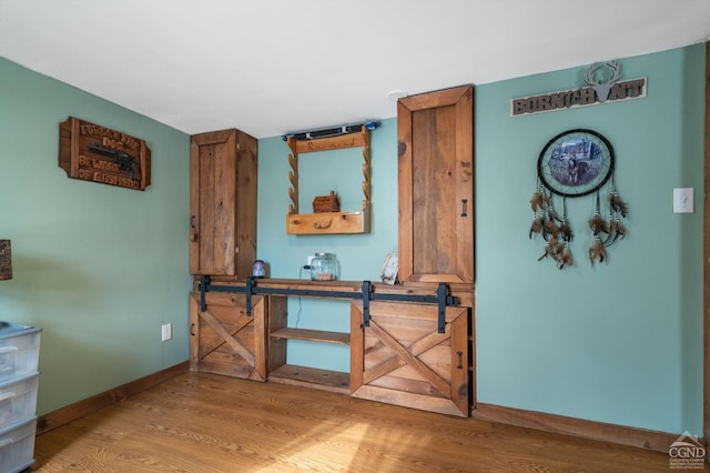 interior space with light wood-style flooring and baseboards