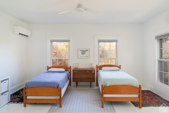 bedroom featuring ceiling fan and a wall mounted air conditioner