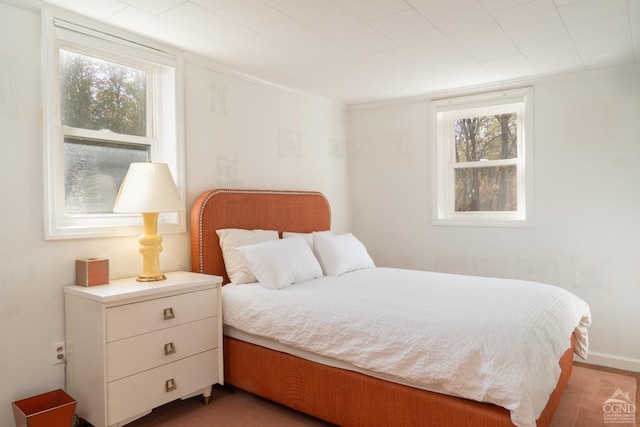 bedroom with hardwood / wood-style flooring