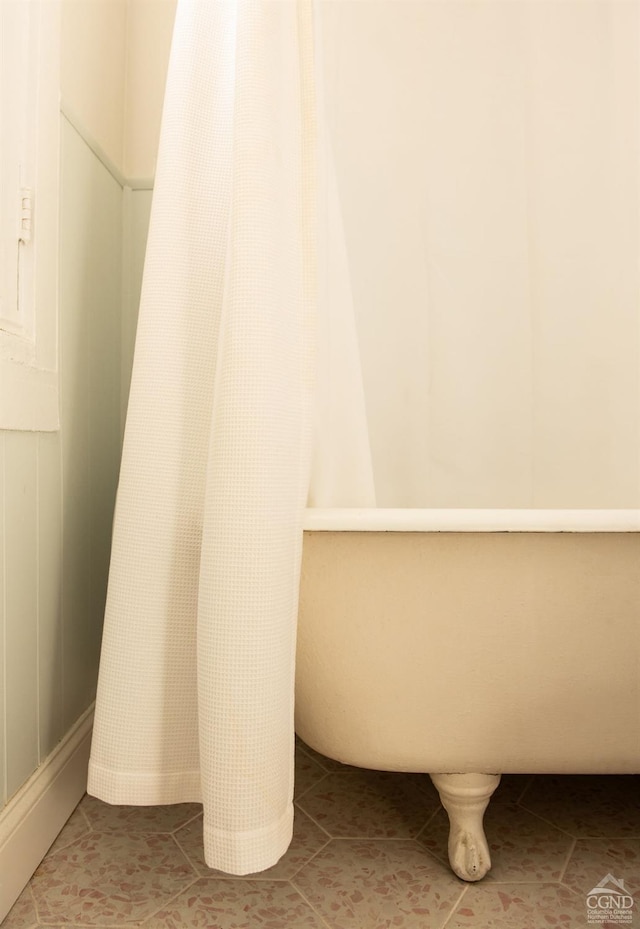 bathroom with tile patterned floors