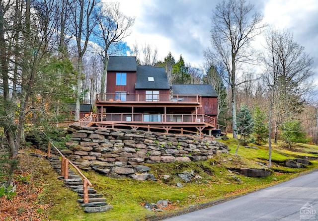 back of house with a wooden deck