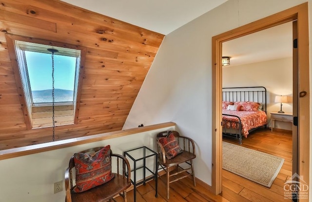 interior space featuring hardwood / wood-style flooring and lofted ceiling