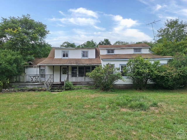 view of front facade with a porch and a front lawn