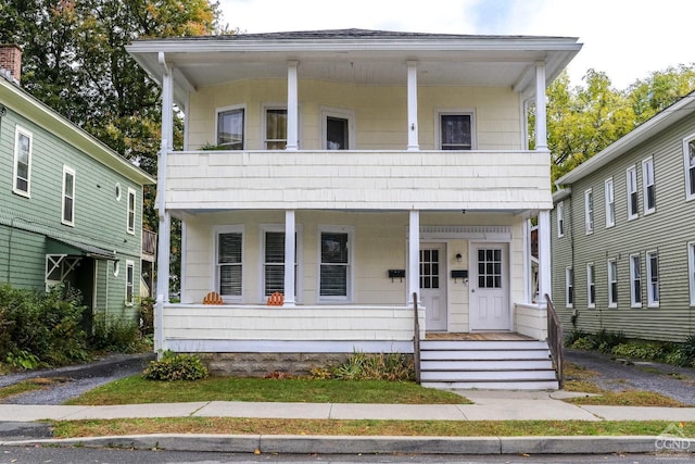 view of front of home with a balcony