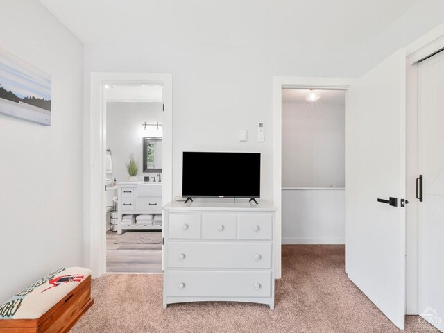 bedroom with a wall mounted AC, carpet, baseboard heating, and ceiling fan