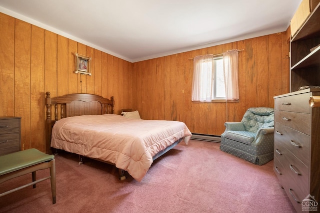 carpeted bedroom with baseboard heating and wood walls