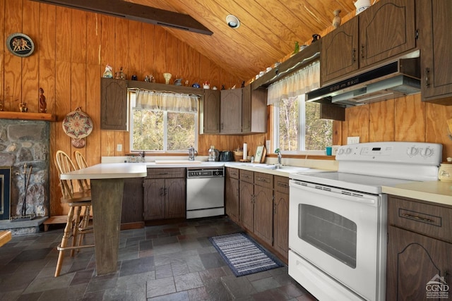 kitchen featuring electric range, dishwasher, vaulted ceiling with beams, and plenty of natural light