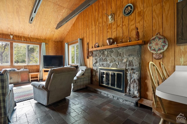 living room featuring lofted ceiling, a stone fireplace, wooden ceiling, and wood walls