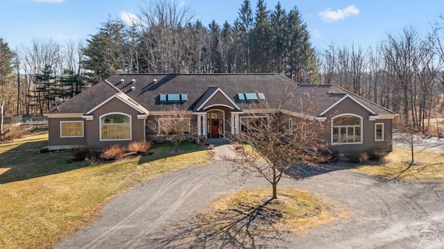 ranch-style home with a front yard