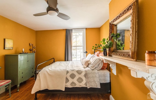 bedroom with hardwood / wood-style flooring and ceiling fan