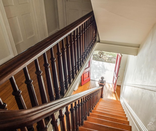 stairway featuring hardwood / wood-style flooring