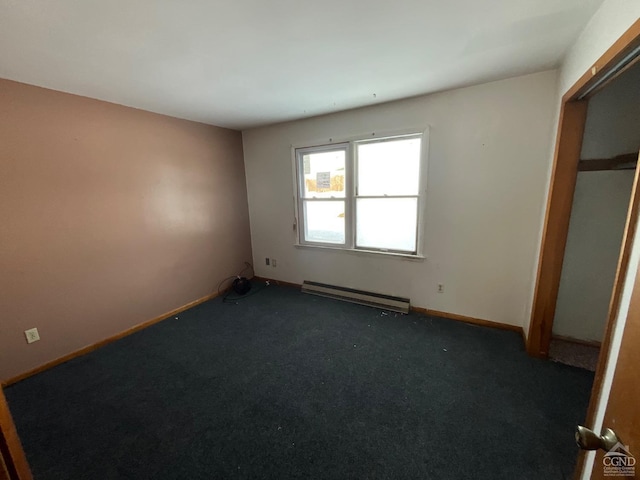 unfurnished bedroom featuring dark carpet, a closet, and a baseboard radiator