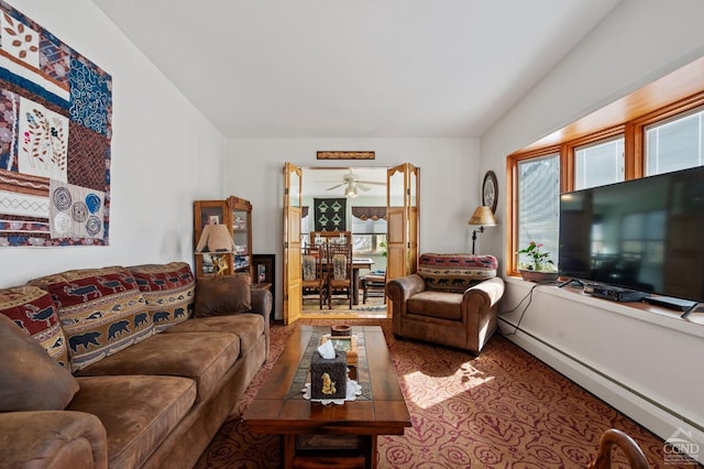 living room featuring a baseboard radiator and a ceiling fan