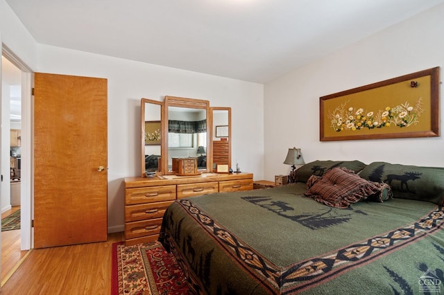 bedroom with light wood finished floors