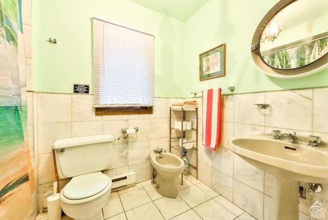 bathroom featuring a baseboard heating unit, a bidet, tile walls, tile patterned flooring, and toilet