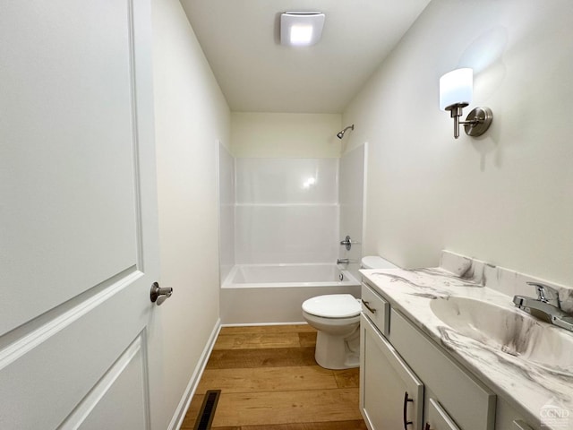 full bathroom featuring visible vents, wood finished floors, vanity, toilet, and shower / bathtub combination