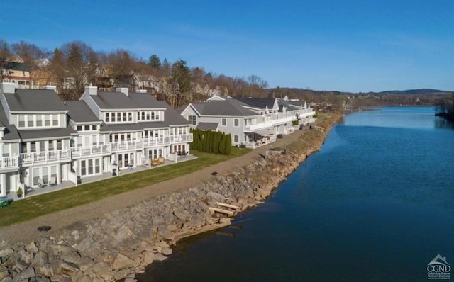 bird's eye view featuring a water view and a residential view