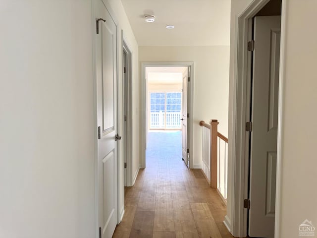 hall with light wood-type flooring