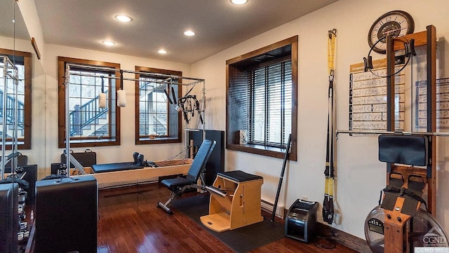 workout area with wood-type flooring