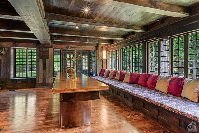 living room with beamed ceiling, hardwood / wood-style floors, and wooden ceiling