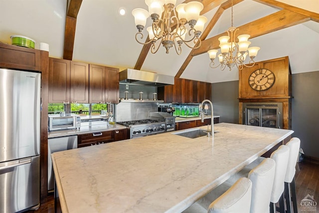 kitchen with beam ceiling, sink, wall chimney exhaust hood, a chandelier, and appliances with stainless steel finishes