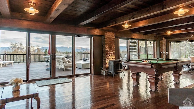 rec room with a mountain view, beam ceiling, hardwood / wood-style flooring, and billiards