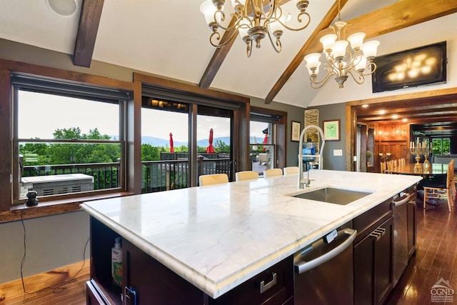 kitchen with a center island with sink, a notable chandelier, dark hardwood / wood-style flooring, and sink