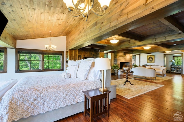 bedroom with hardwood / wood-style floors, a notable chandelier, lofted ceiling with beams, and wooden ceiling