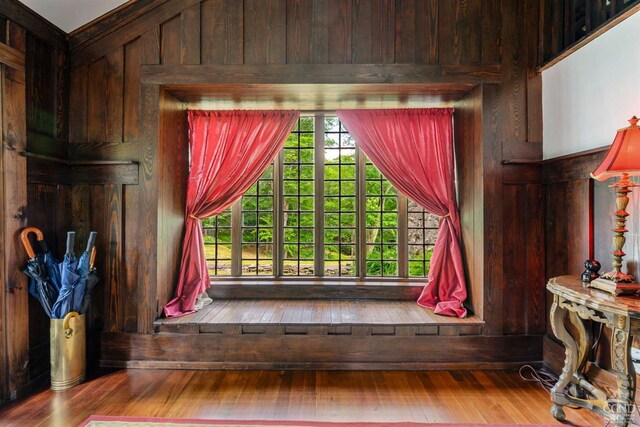 room details featuring hardwood / wood-style flooring and wooden walls