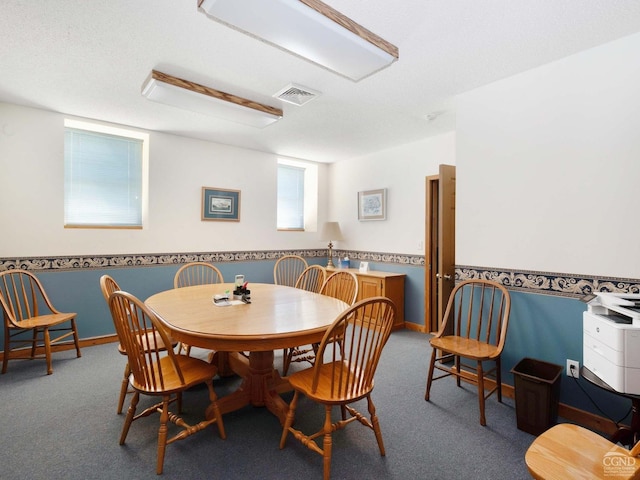 view of carpeted dining area