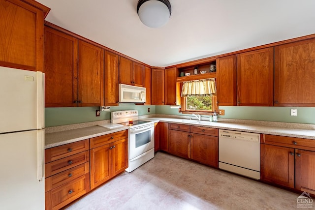 kitchen with sink and white appliances