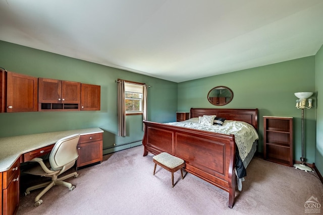 carpeted bedroom with baseboard heating and built in desk