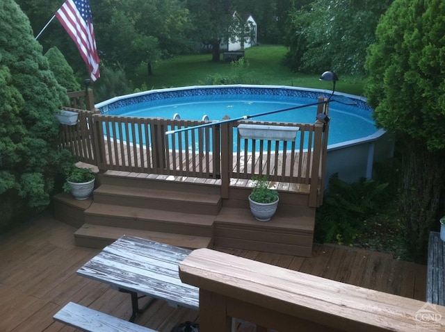 view of pool featuring a wooden deck