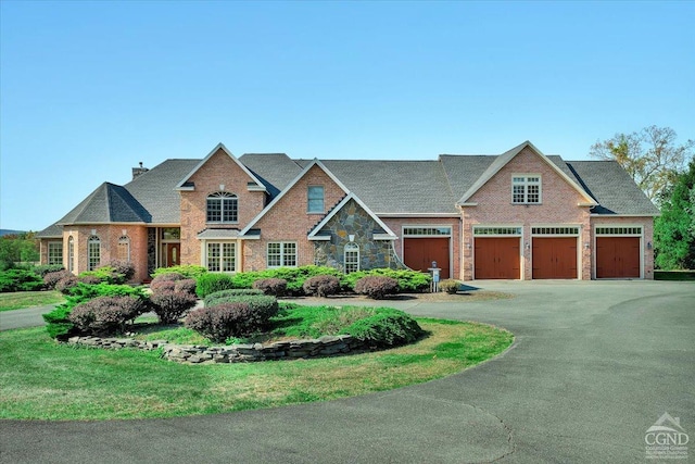 craftsman-style home featuring a front lawn