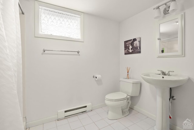bathroom featuring a shower with shower curtain, a baseboard heating unit, baseboards, toilet, and tile patterned floors