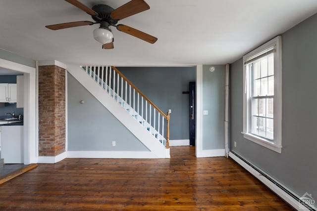 entryway with sink, dark wood-type flooring, ceiling fan, and baseboard heating