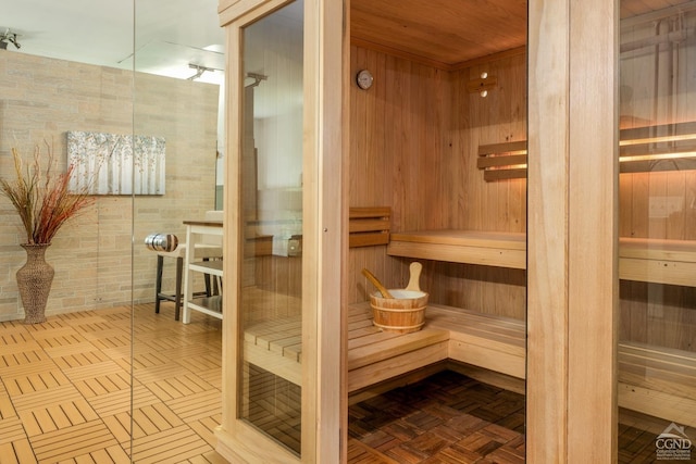 view of sauna with parquet flooring