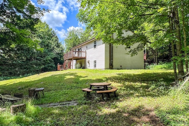 view of yard featuring a wooden deck