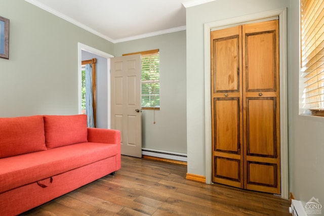 sitting room with dark hardwood / wood-style floors, ornamental molding, and a baseboard radiator