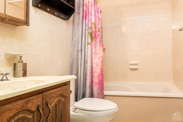 full bathroom with shower / tub combo, vanity, toilet, and tile walls