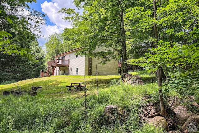 view of yard featuring a wooden deck