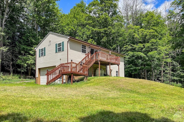 view of front of house with a deck and a front yard