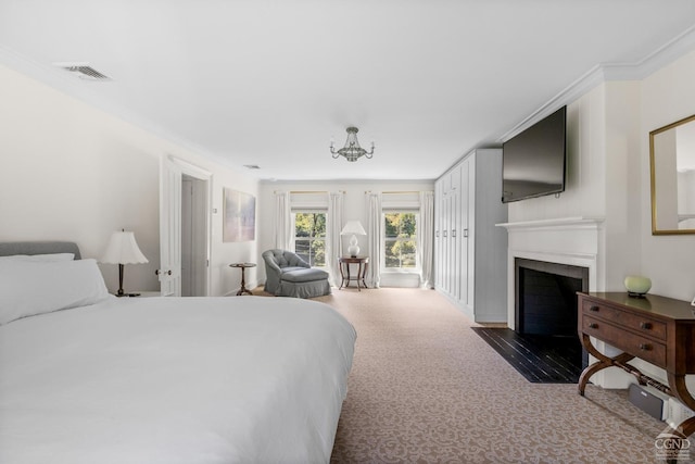 bedroom with a chandelier, ornamental molding, and dark colored carpet