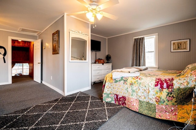 carpeted bedroom with crown molding, baseboards, and multiple windows